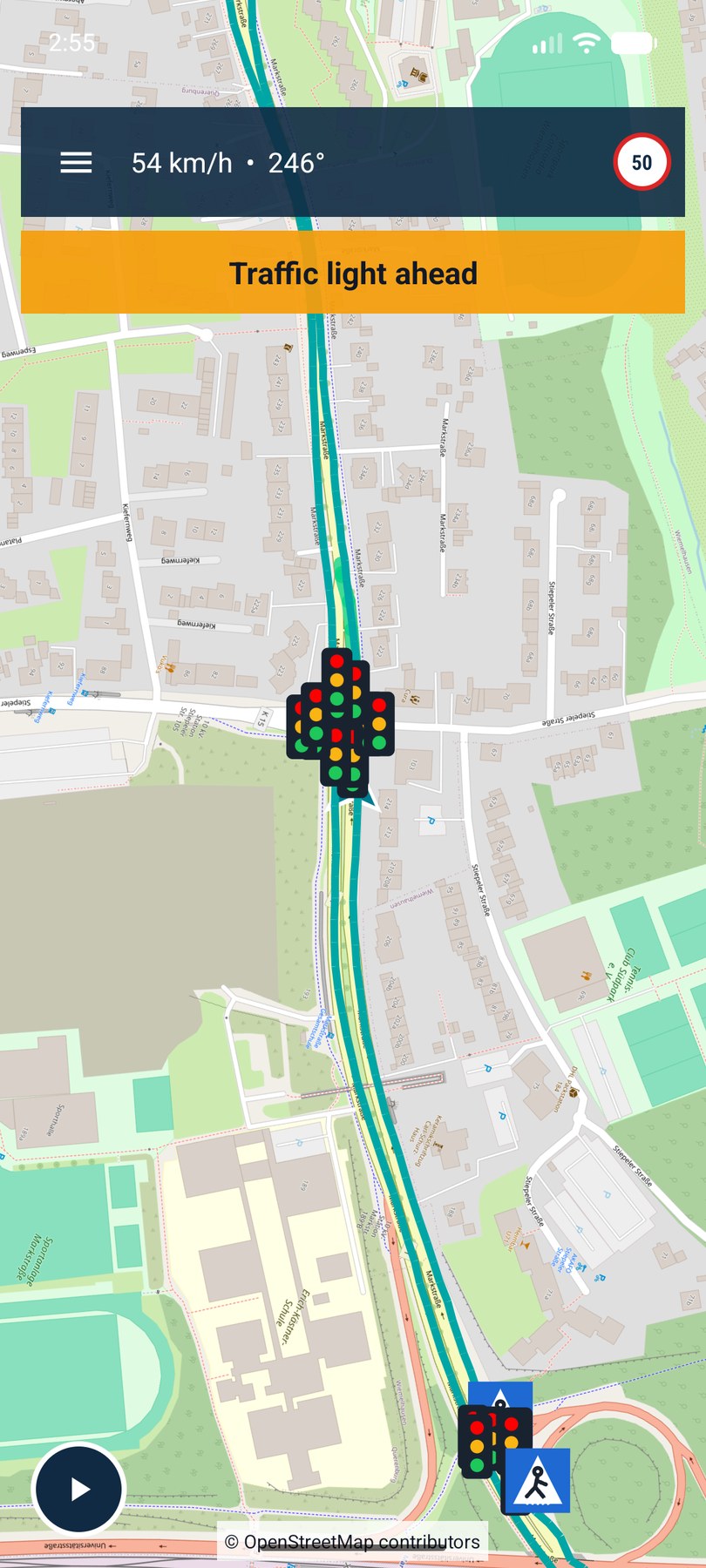 Map screen with a 'Traffic light ahead' warning banner